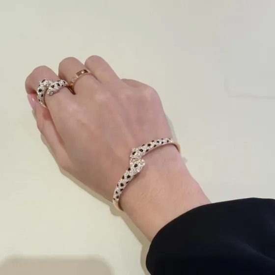Cartier Panthere de Cartier bracelet 18K yellow gold paved with diamonds black onyx spots emerald eyes 17