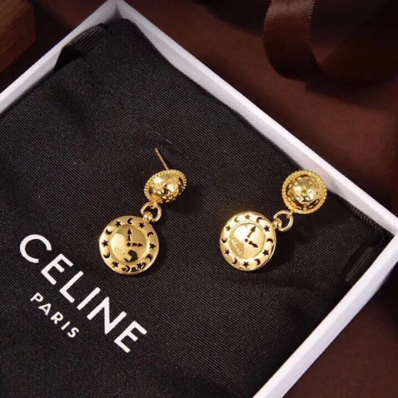 Celine Celestial Clock Drop Earrings earrings gold-tone metal with black and orange enamel star and moon detailing 2 5cm drop length
