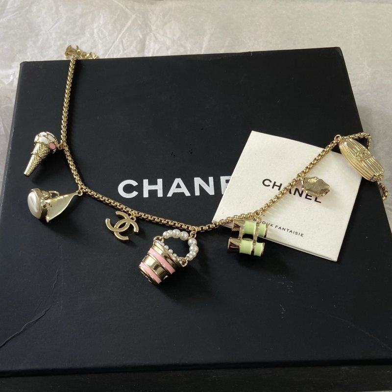Chanel CC Logo Beach Vacation Charms Collection necklace Gold-tone metal with white faux pearls pink enamel light green enamel clear crystal accents and cream pearl cabochon 42cm with 5cm extender chain