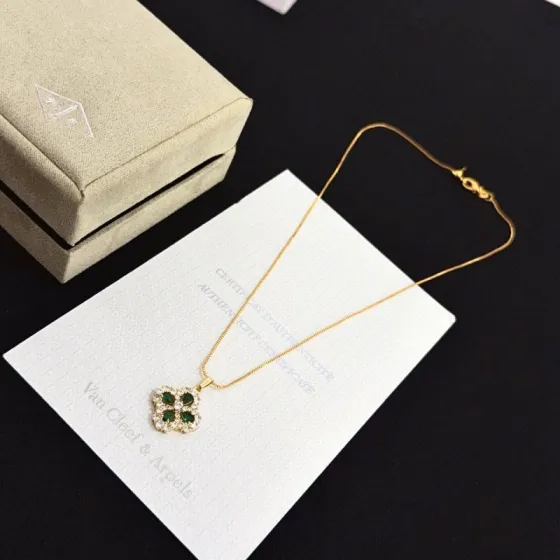 Van Cleef Arpels Alhambra necklace yellow gold metal with green gemstones and clear diamond accents 42cm