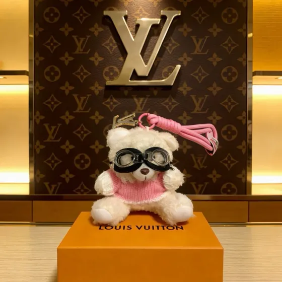 Louis Vuitton Anger Forest Pilot Bear Bag Charm pendant Silver-tone metal hardware pink braided cord cream white plush pink knit sweater black and clear goggles 12cm charm with 10cm pink cord strap