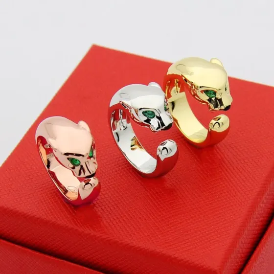 Cartier Panthere de Cartier ring 18k rose gold 18k white gold 18k yellow gold with green tsavorite garnet eyes and black onyx nose accents adjustable open band