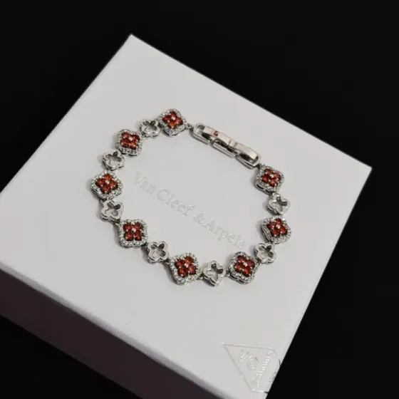 Van Cleef Arpels Alhambra bracelet silver-toned metal with red gemstones and white diamond accents 18cm