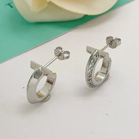 Tiffany T T1 earrings silver-toned metal with clear diamond accents 10mm hoop diameter