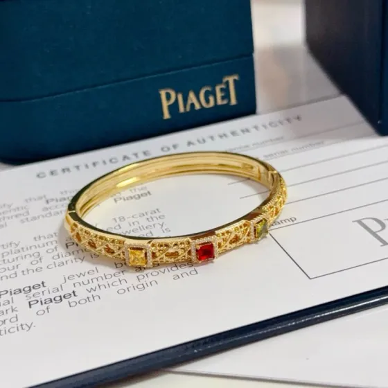 Piaget Sunlight Journey bracelet 18k yellow gold with red yellow green gemstones and diamond accents 17cm inner circumference