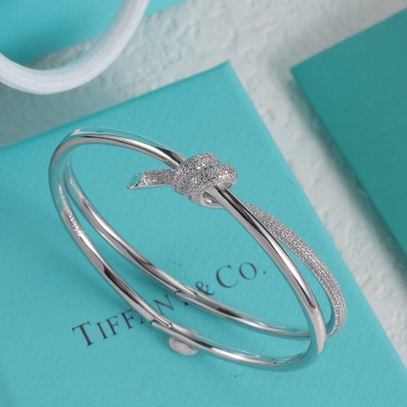 Tiffany Co Fate Knot bracelet Available in 18k white gold 18k yellow gold 18k rose gold all set with pave-set clear diamonds 17cm inner circumference