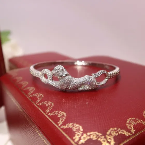Cartier Panthere de Cartier bracelet 18K white gold pave diamonds tsavorite garnet eyes black onyx nose 17