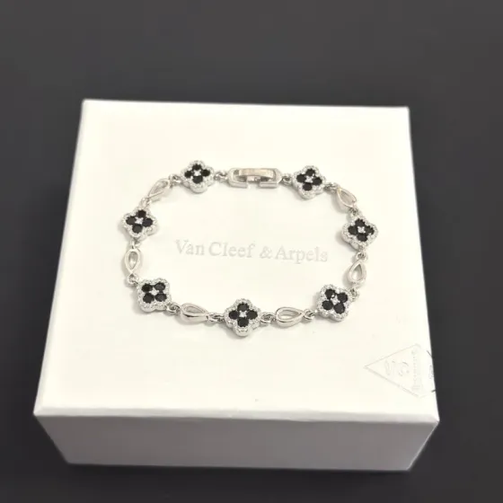 Van Cleef Arpels Alhambra bracelet silver-toned metal with black onyx and clear diamond accents 18cm