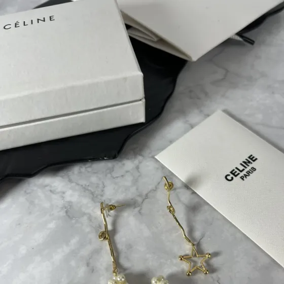 Celine YHED050 Asymmetric Star Pearl Drop earrings gold-tone metal cream white faux pearl 6cm drop length