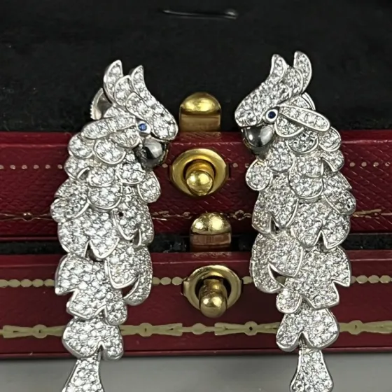 Cartier Les Oiseaux Liberes Parrot earrings 18k white gold pave set white diamonds blue sapphire eyes black rhodium plated beaks 4 8cm length