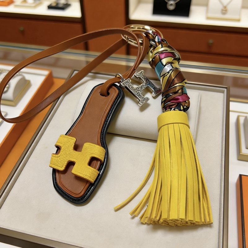 Hermes Oran Sandal Tassel Bag Charm Keychain pendant Gold-tone metal brown leather yellow leather multicolor silk silver-tone H charm black edge trim 15cm total length