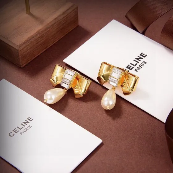 Celine Bow Pearl Drop earrings gold-tone metal clear baguette-cut crystals cream teardrop faux pearl 3 2cm drop length