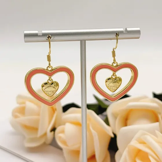 Tiffany Co Return to Tiffany Double Heart earrings gold-tone metal with coral pink enamel 3 5cm drop length