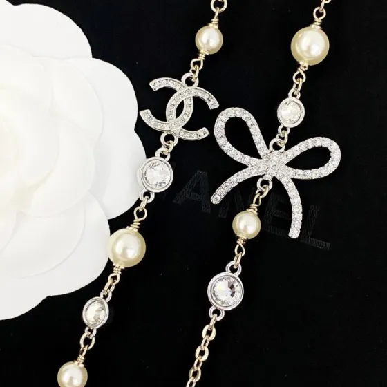 Chanel CC Bow Crystal Pearl Long Necklace necklace Light gold tone metal cream faux pearls clear crystal rhinestones 80cm with 5cm extender