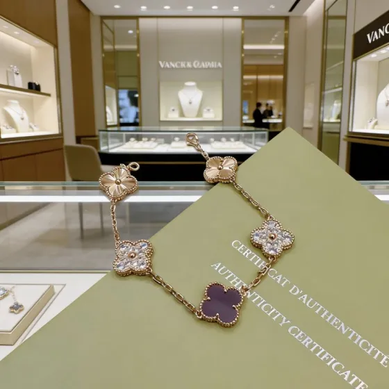 Van Cleef Arpels Alhambra bracelet Rose gold metal with clear diamond accents and dark purple stone clover motifs 19cm