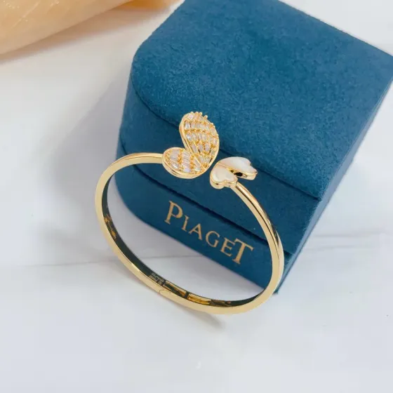 Piaget Butterfly bracelet gold-tone metal with white mother-of-pearl and clear baguette-cut stones 17cm