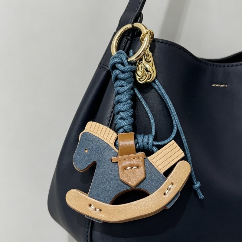 Hermes Rocking Horse Bag Charm pendant Gold-tone metal deep blue braided cord deep blue tan and light beige leather 12cm total length