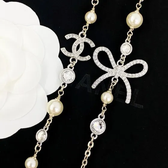Chanel CC Bow Crystal Pearl Long Necklace necklace Light gold tone metal cream faux pearls clear crystal rhinestones 80cm with 7cm extender