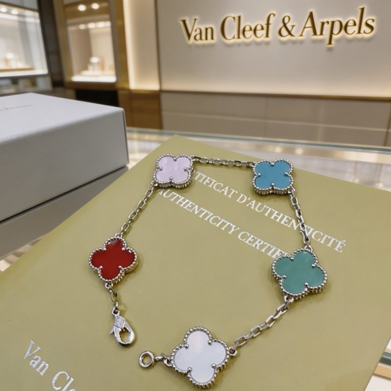 Van Cleef Arpels Alhambra bracelet Silver-toned metal with multicolor clover inlays light pink turquoise blue red teal green white mother-of-pearl 17cm