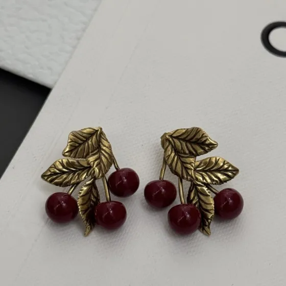 Saint Laurent Cherry Motif earrings antique gold metal deep burgundy red resin cherries 2 5cm length