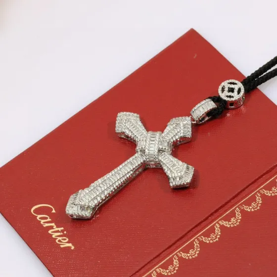 Cartier Diamond Cross Pendant pendant White gold with clear baguette and round diamonds black cord 24 inch black cord chain