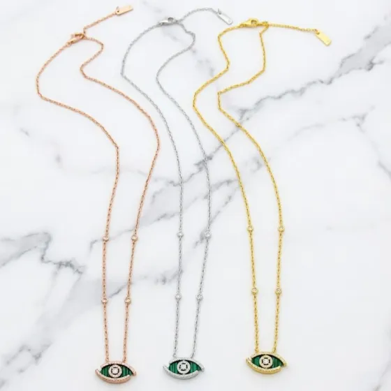 Messika Lucky Eye Evil Eye Pendant Necklace necklace Available in 18k rose gold 18k white gold 18k yellow gold set with malachite or turquoise accented with pave diamonds and a central diamond 42cm with 5cm extender