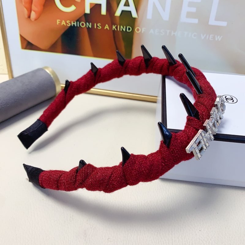 Chanel Crystal Logo Spiked Headband brooch Red fabric with black spikes and silver-tone crystal logo Black and white tweed fabric with black spikes and gold-tone CD logo One Size