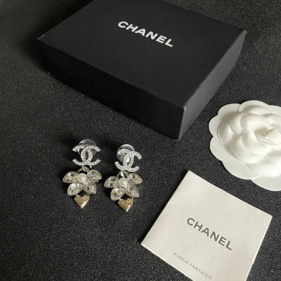 Chanel CC Logo Flower Heart Drop Earrings earrings Silver-tone metal with clear crystals white faux pearl and gold-tone heart accent Approximately 3cm drop length