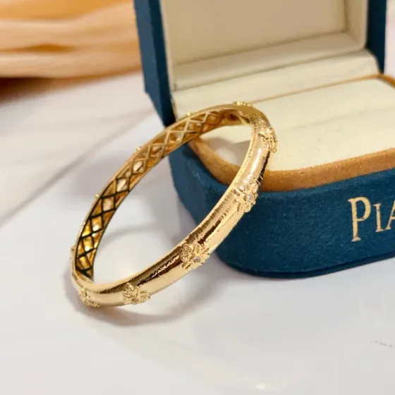 Piaget Rose Bangle bracelet 18k yellow gold with clear diamond accents 17cm inner circumference