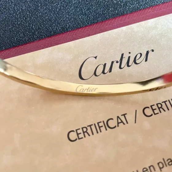 Cartier Love bracelet 18k yellow gold clear diamond accents 17