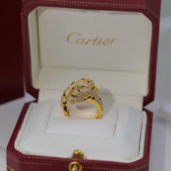 Cartier Panthere de Cartier ring 18K yellow gold pave set clear diamonds black onyx spots green tsavorite garnet eyes US 7