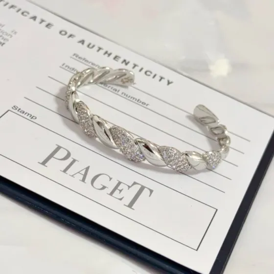 Piaget Twist Cuff bracelet silver-toned white gold with clear pave diamonds 17cm inner circumference