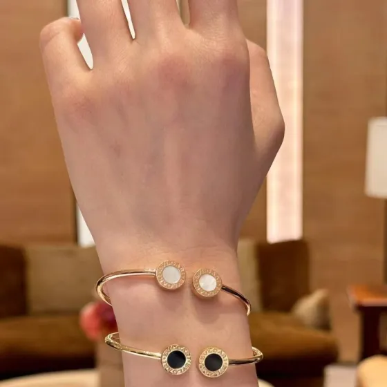 Bvlgari Bvlgari Bvlgari Open Cuff Bangle bracelet Available in rose gold yellow gold silver metal options with white mother-of-pearl or black onyx stone inlays 17cm
