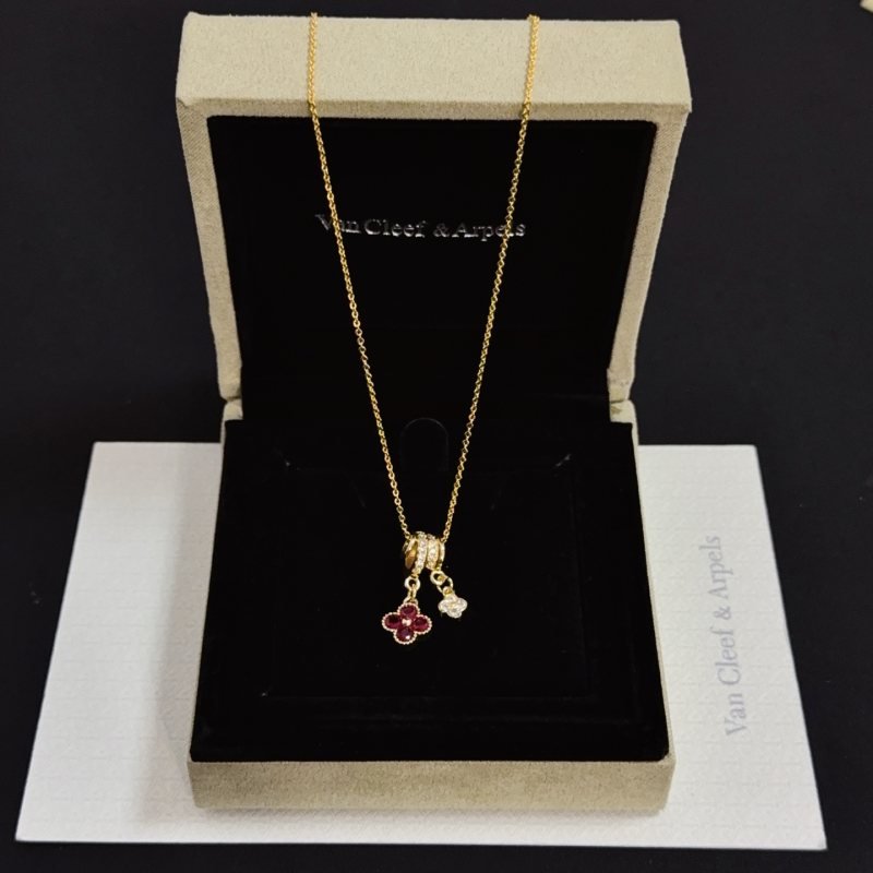 Van Cleef Arpels Alhambra necklace yellow gold with ruby red and clear diamond accents 42cm