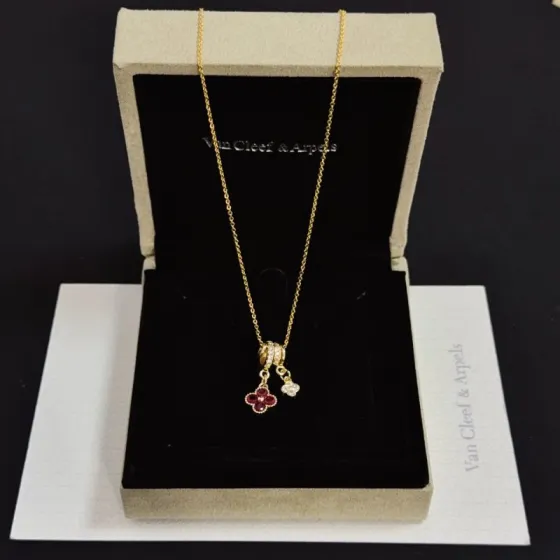 Van Cleef Arpels Alhambra necklace yellow gold with ruby red and clear diamond accents 42cm
