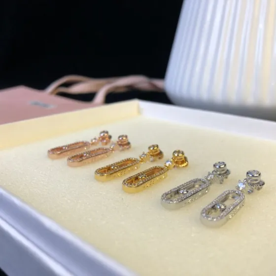 Messika Move Uno earrings Available in 18k rose gold 18k yellow gold and 18k white gold all set with clear round brilliant diamonds 2 5cm drop length