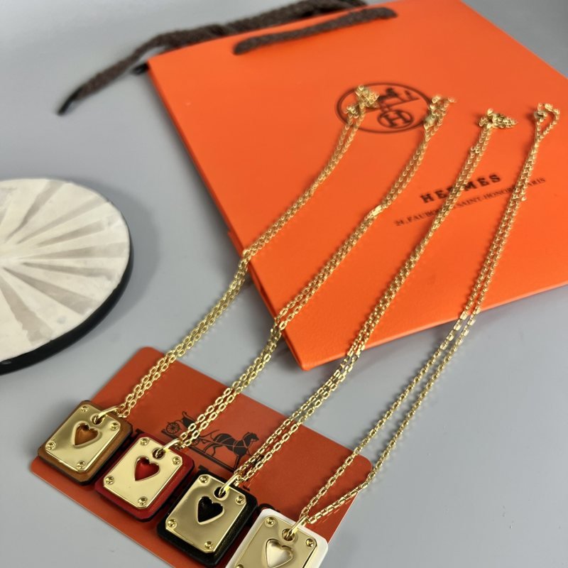 Hermes Swift Skeleton Heart Pendant necklace Gold-tone metal with brown red black and white Swift leather accents 40cm