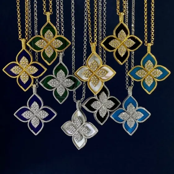 Roberto Coin Princess Flower necklace Yellow gold with diamond accents available variants with white mother-of-pearl blue lapis lazuli green malachite black onyx turquoise inlays silver-toned white gold variants with matching stone inlays and diamond accents 18 inches
