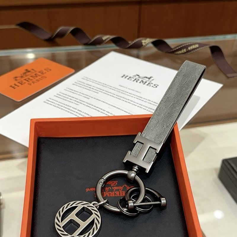 Hermes H Logo Leather Strap Keychain pendant Gunmetal gray metal matte gray leather strap silver-toned H charm with black striped detailing 10cm total length