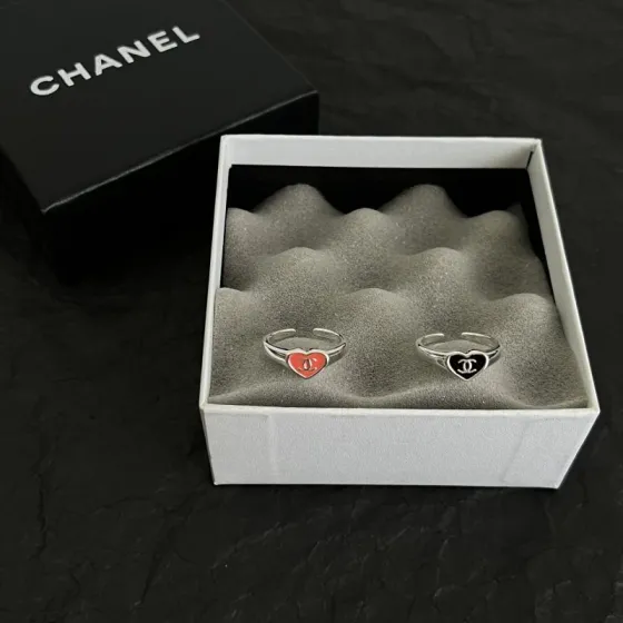 Chanel CC Heart Enamel Signet Ring ring silver-toned metal with coral red and black enamel heart accents featuring interlocking CC logo adjustable open band