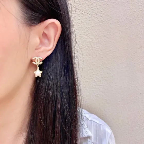 Chanel CC Star Drop Earrings earrings Gold-tone metal with cream pearl CC detailing and white mother-of-pearl star charms One Size drop length approx 2cm