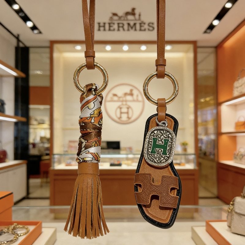 Hermes Oran Sandal Tassel Bag Charm pendant Gold-tone metal tan leather multicolor printed silk brown leather green enamel silver-tone metal black leather trim 12cm total length