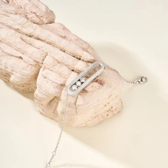 Messika Baby Move bracelet available in brushed silver-tone metal with clear round stones and brushed rose gold-tone metal with clear round stones adjustable 16-19cm