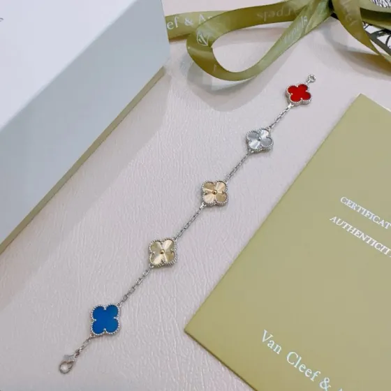 Van Cleef Arpels Alhambra bracelet Silver-toned metal with gold-toned accents red carnelian blue agate silver guilloche gold guilloche clover motifs 17cm