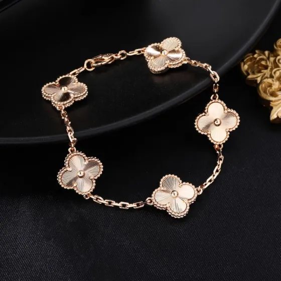 Van Cleef Arpels Vintage Alhambra bracelet Rose gold with guilloche engraved clover motifs no gemstones 18cm