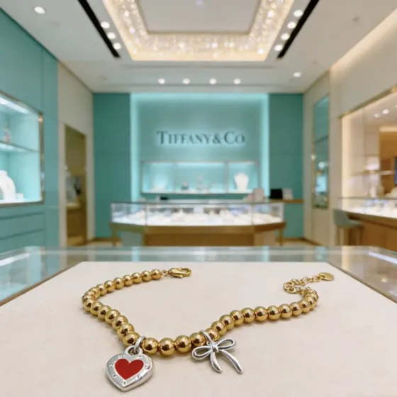 Tiffany Co Return to Tiffany Heart Tag Bead Bracelet with Bow Charm bracelet Gold-tone metal beads silver-tone metal charms red enamel heart detail 18cm
