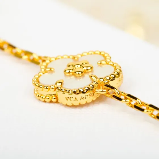 Van Cleef Arpels Lucky Alhambra bracelet 18k yellow gold white mother-of-pearl blue lapis lazuli green malachite 18cm