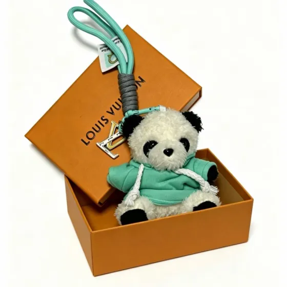 Louis Vuitton Anger Forest Panda Charm Keychain pendant Mint green cord gray wrapped cord silver-tone metal with gold LV logo white and black plush panda with mint green hoodie 12cm total length with 8cm wrist strap