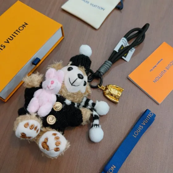Louis Vuitton Anger Forest pendant Gold-tone metal black cord beige plush pink plush black knit white pom-pom accents 12cm