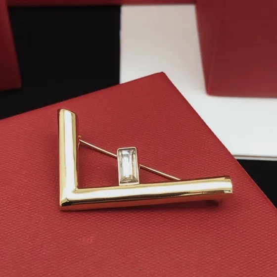 Fendi FF Logo Crystal Brooch brooch gold-tone metal with clear baguette-cut crystal 4 5cm width